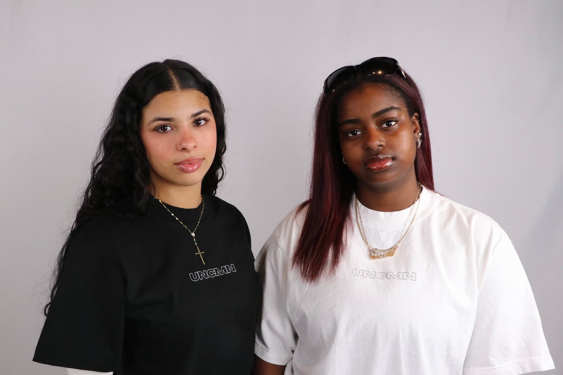 Black and white UNCMN tees
